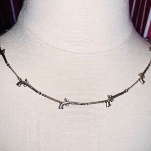 Disney 2006 Johnny Depp Pirates Pistol Necklace